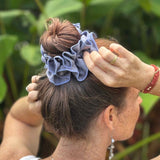 Scrunchie with ruffle for volume and texture. Made from organic cotton satin silk #color_blue-granite