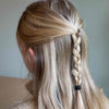 Blonde girl with hair in high plait half up and half down style with black KOOSHOO hair tie 