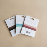 KOOSHOO's range of 2 pack hair ties. All are 100% organic, biodegradable, ethically sourced and locally made #color_brown-black #color_wild-plum #color_south-pacific