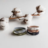 KOOSHOO plastic free hair ties classics pictured with organic cotton branch #color_classics
