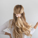 KOOSHOO plastic-free scrunchies in blush walnut. Blush scrunchie in blond hair, half up half down beach waves #color_blush-walnut